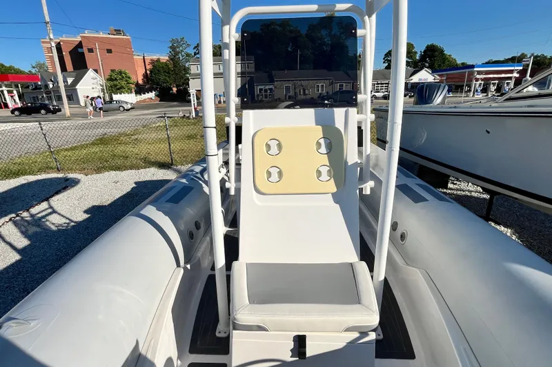 Slide: The Image of 2023 Inmar 550R-YS Yacht Series boat interior with seating and console. - 24