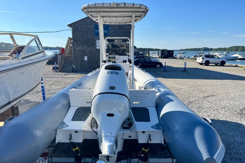 Slide: The Image of 2023 Inmar 550R-YS Yacht Series inflatable boat at marina, rear view. - 4