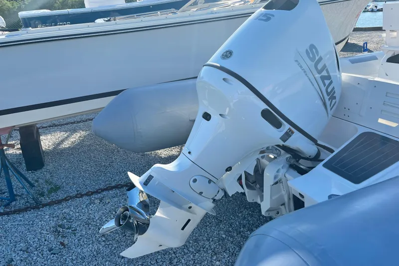 Slide: The Image of 2023 Inmar 550R-YS Yacht Series with Suzuki outboard motor on display. - 6