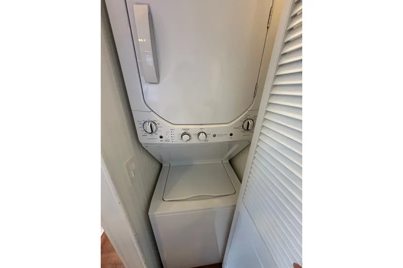 Slide: The Image of Stacked washer and dryer unit in a 1992 Sumerset 14x64 houseboat. - 12