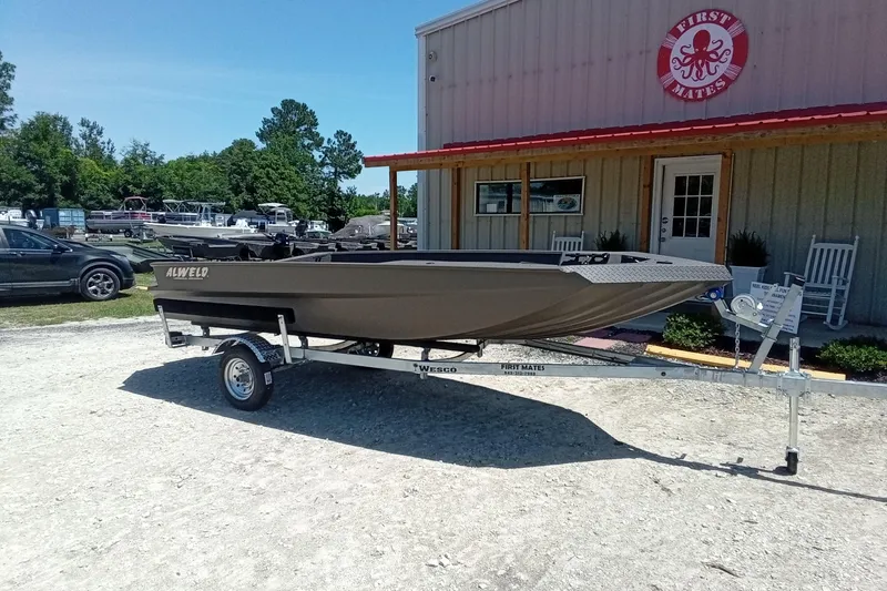 Slide: The Image of 2026 Alweld 1652 Invader boat on trailer outside First Mates store. - 13