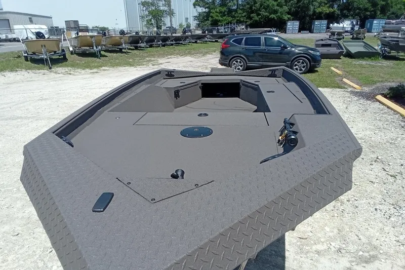 Slide: The Image of 2026 Alweld 1652 Invader boat with diamond plate deck in outdoor setting. - 15