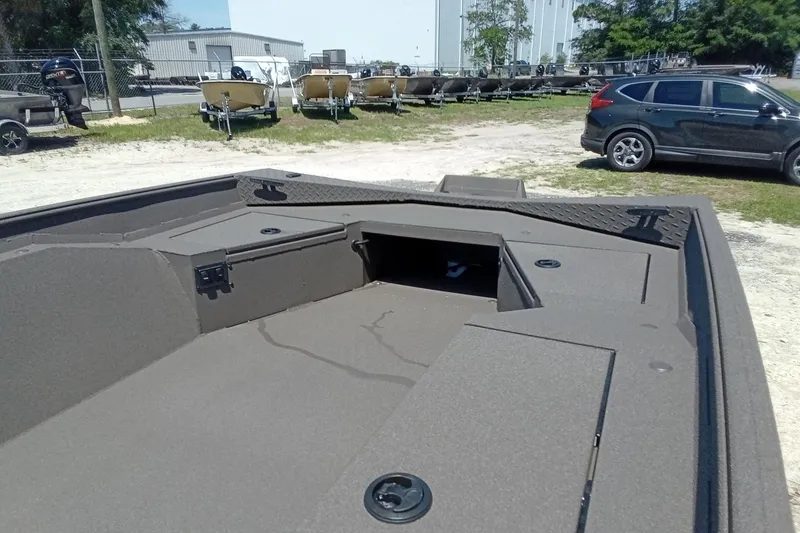Slide: The Image of 2026 Alweld 1652 Invader boat interior, showcasing storage compartments and rugged design. - 17