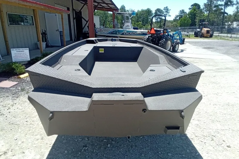 Slide: The Image of 2026 Alweld 1652 Invader boat displayed outdoors, showcasing its spacious interior and rugged design. - 19