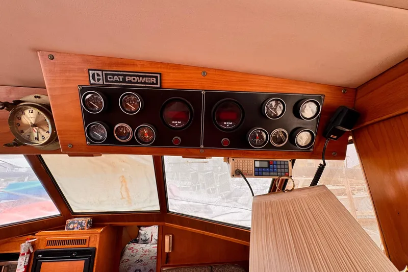 Slide: The Image of Control panel of a 1985 Symbol 51 boat with gauges and "Cat Power" label. - 15