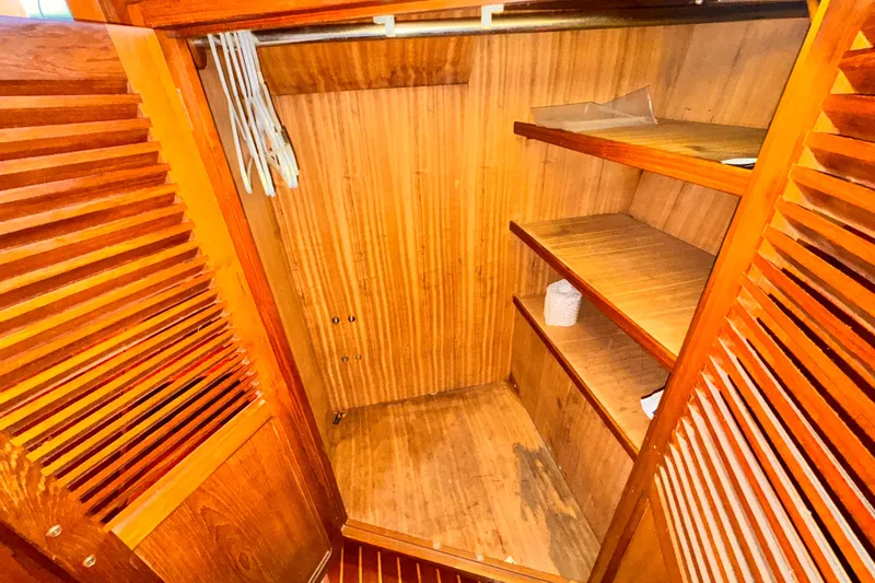 Slide: The Image of Wooden closet interior with shelves and hangers, Symbol 51 model, 1985. - 21