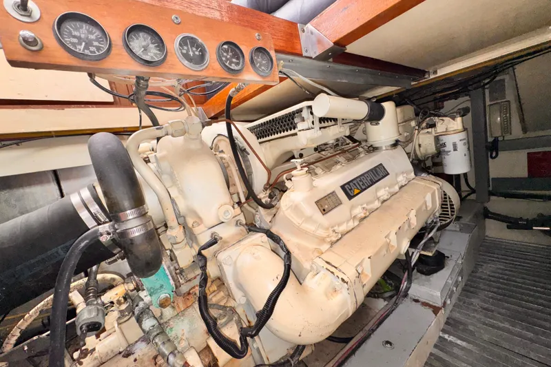 Slide: The Image of Engine room of a 1985 Symbol 51 yacht with Caterpillar engine and gauges. - 31