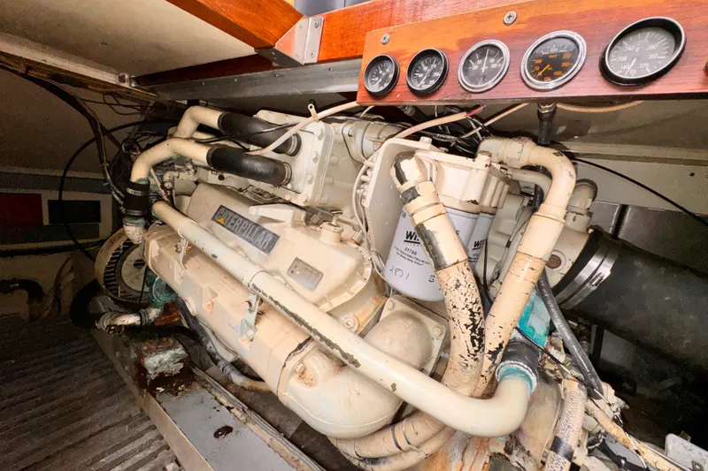 Slide: The Image of Engine room of a 1985 Symbol 51 yacht with Caterpillar engine and gauges. - 33