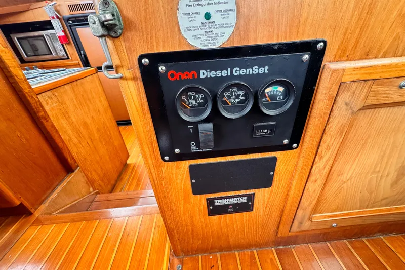 Slide: The Image of 1985 Symbol 51 yacht interior with Onan Diesel GenSet control panel. - 36