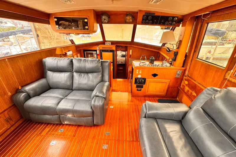 Slide: The Image of Luxurious 1985 Symbol 51 yacht interior with leather seating and wooden finishes. - 6