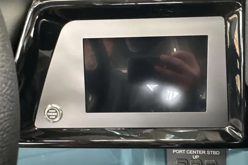 Slide: The Image of Dashboard of 2026 MasterCraft NXT22 boat with touchscreen and start button. - 11