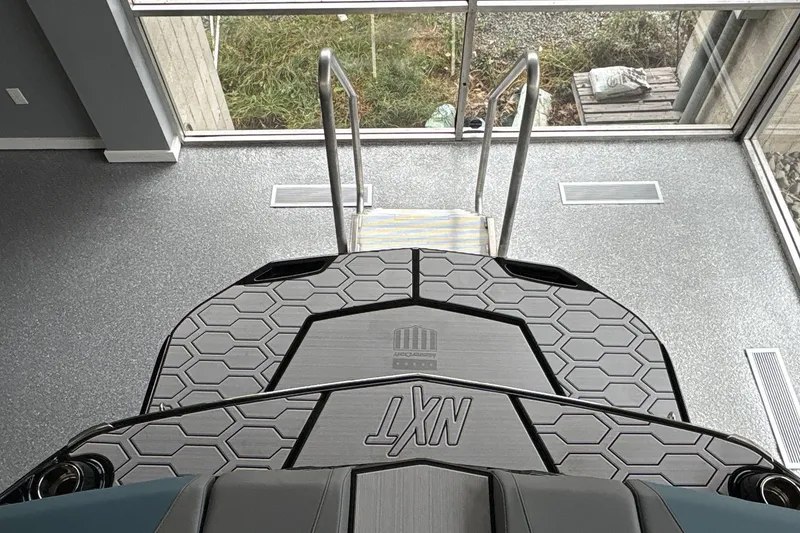 Slide: The Image of 2026 MasterCraft NXT22 boat interior with hexagonal pattern flooring. - 4