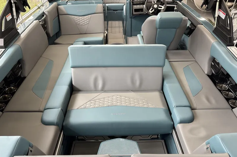 Slide: The Image of 2026 MasterCraft NXT22 boat interior with luxurious seating and modern design. - 7
