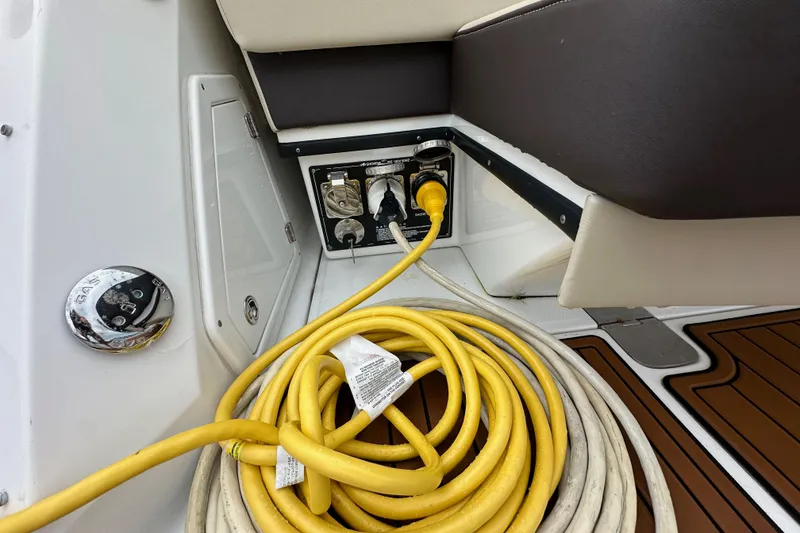 Slide: The Image of Yellow power cable and gas cap on 2018 Monterey 360 Sport Coupe boat. - 13