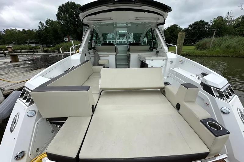 Slide: The Image of 2018 Monterey 360 Sport Coupe boat interior with spacious seating and modern design. - 14