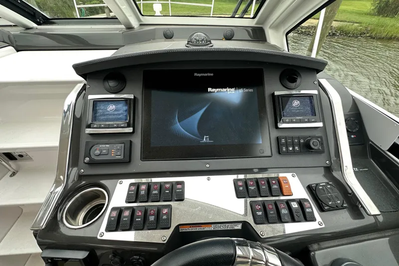 Slide: The Image of Cockpit dashboard of 2018 Monterey 360 Sport Coupe with navigation and control systems. - 2