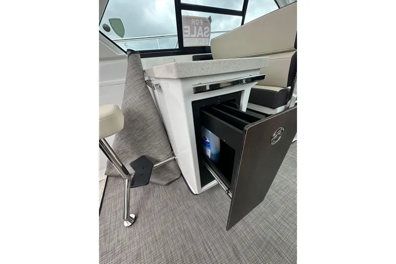 Slide: The Image of 2018 Monterey 360 Sport Coupe interior with open storage compartment and modern design. - 22