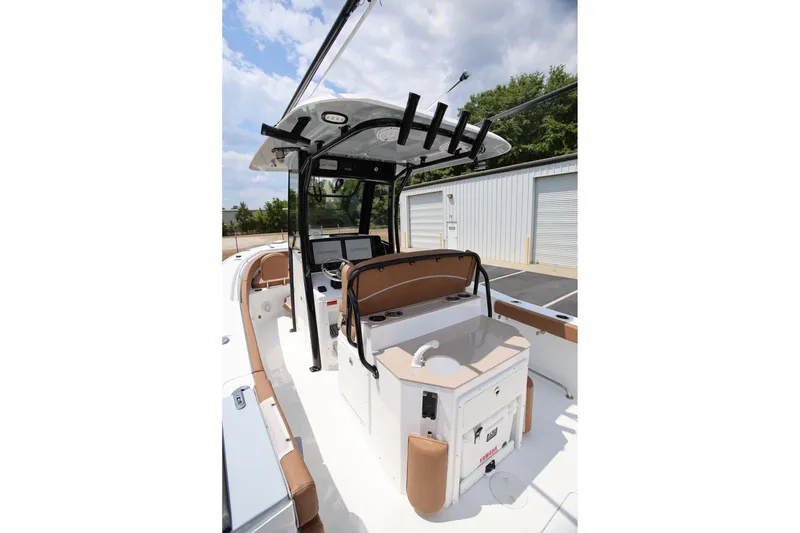 Slide: The Image of 2024 Sea Hunt Ultra 275 SE boat interior with helm and seating area. - 9