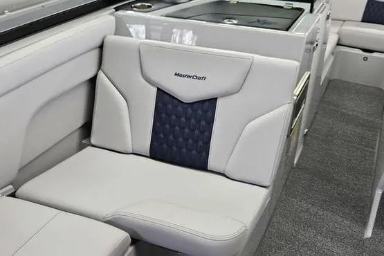 Slide: The Image of 2026 MasterCraft XT24 boat interior with luxurious seating and modern design. - 11