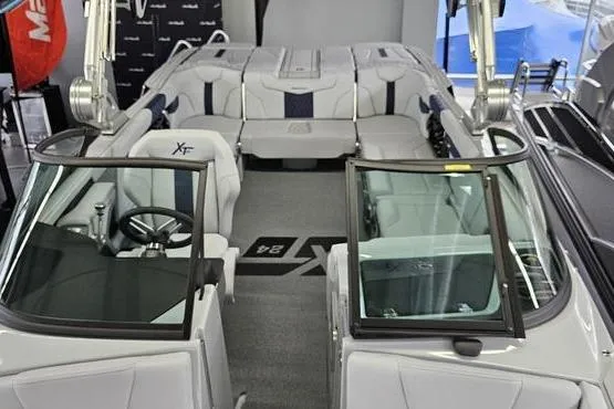 Slide: The Image of 2026 MasterCraft XT24 boat interior with sleek seating and modern design. - 13