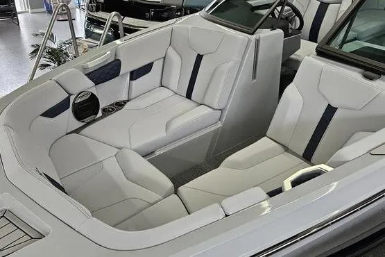 Slide: The Image of 2026 MasterCraft XT24 boat interior with luxurious white seating and modern design. - 15
