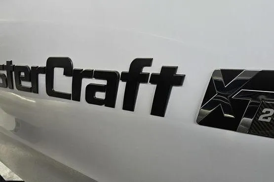 Slide: The Image of 2026 MasterCraft XT24 logo on sleek white surface. - 16
