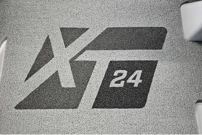 Slide: The Image of 2026 MasterCraft XT24 logo on textured surface. - 22