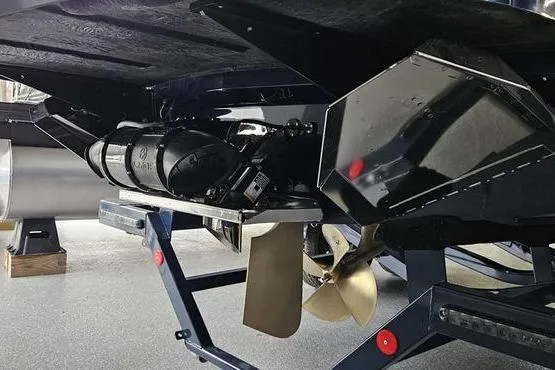 Slide: The Image of 2026 MasterCraft XT24 boat underside showing propeller and hull details. - 25