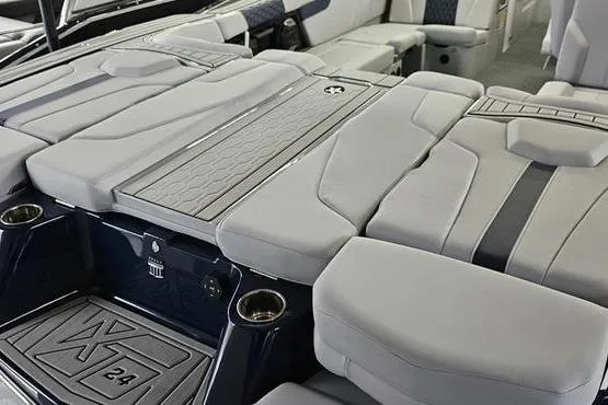 Slide: The Image of 2026 MasterCraft XT24 boat interior with luxurious seating and modern design. - 3