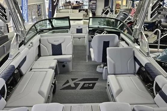Slide: The Image of 2026 MasterCraft XT24 boat interior with luxurious seating and modern design. - 5