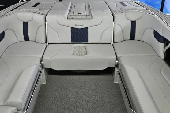 Slide: The Image of 2026 MasterCraft XT24 boat interior with luxurious seating and modern design. - 7