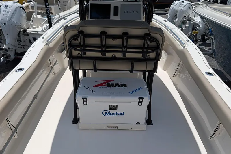 Slide: The Image of 2024 Key West 239 FS boat interior with cooler and seating. - 11