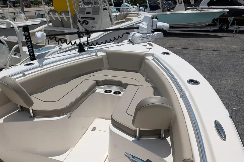 Slide: The Image of 2024 Key West 239 FS boat interior with cushioned seating and fishing equipment. - 18