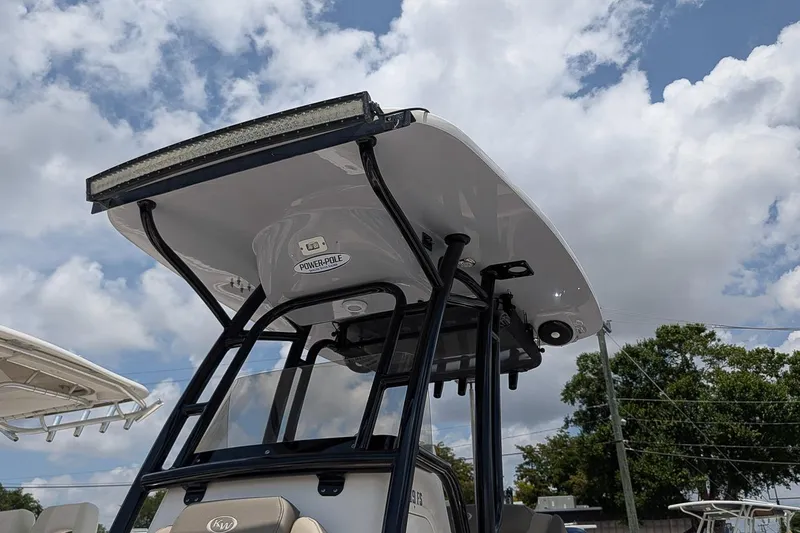 Slide: The Image of 2024 Key West 239 FS boat with T-top under a cloudy sky. - 24