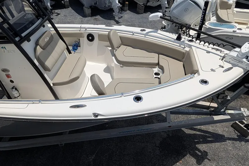 Slide: The Image of 2024 Key West 239 FS boat interior with beige seating and modern design. - 8