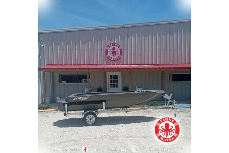 The Image of 2026 Alweld 1548 Invader boat on trailer outside First Mates building. - 1