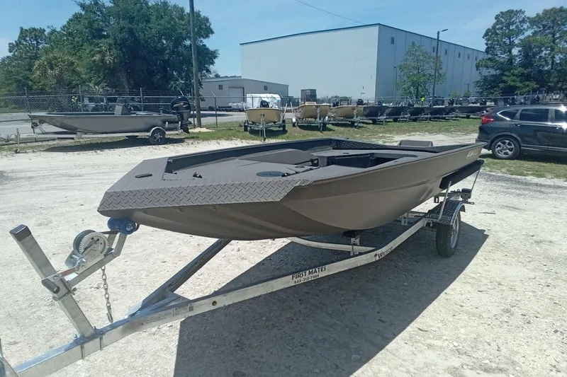 Slide: The Image of 2026 Alweld 1548 Invader boat on trailer in outdoor setting. - 5