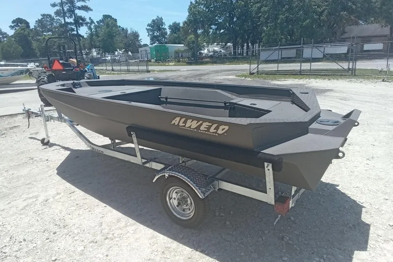 Slide: The Image of 2026 Alweld 1548 Invader boat on trailer in outdoor setting. - 7