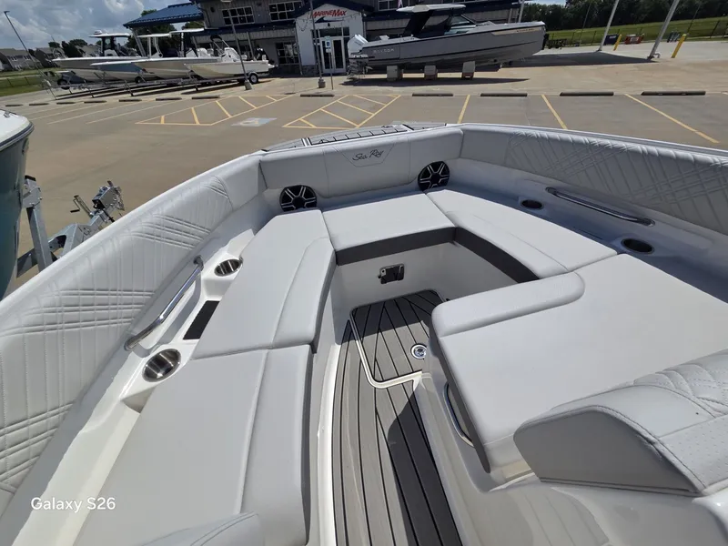 Slide: The Image of The image shows the spacious bow area of a Sea Ray SDX 250 boat with luxurious seating. - 18