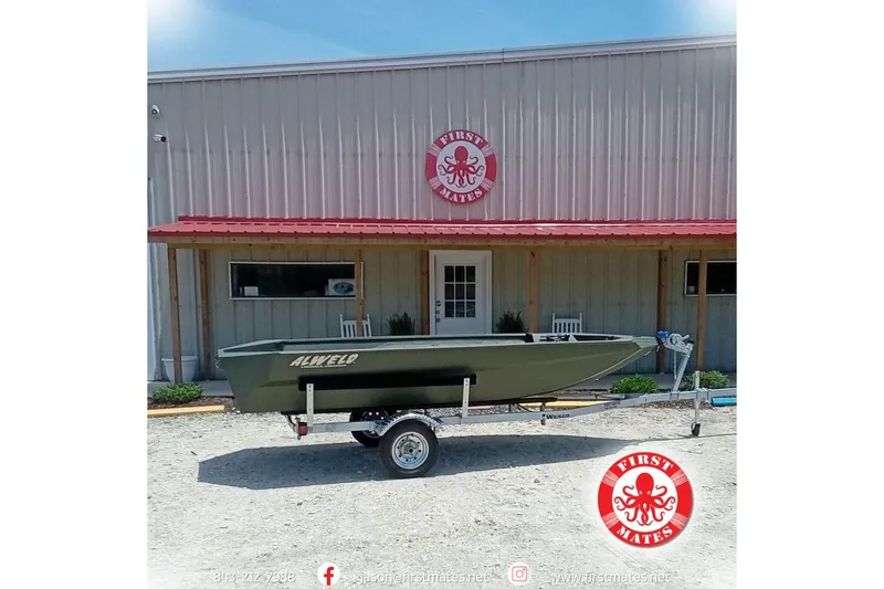 The Image of 2026 Alweld 1548 Invader boat on trailer outside First Mates building. - 10