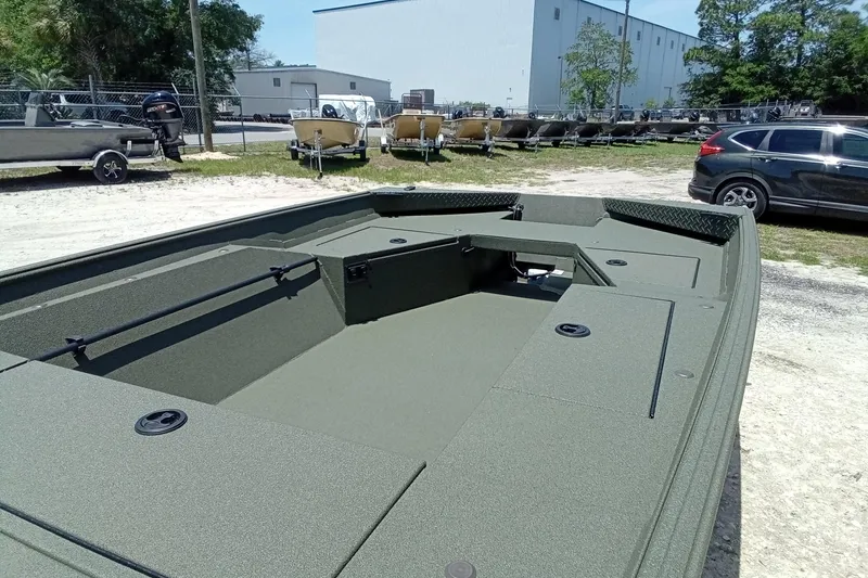 Slide: The Image of 2026 Alweld 1548 Invader boat in a parking lot, showcasing its spacious interior design. - 15