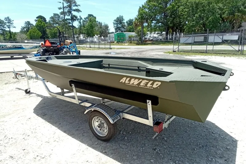 Slide: The Image of 2026 Alweld 1548 Invader boat on trailer, outdoors in a sunny setting. - 16
