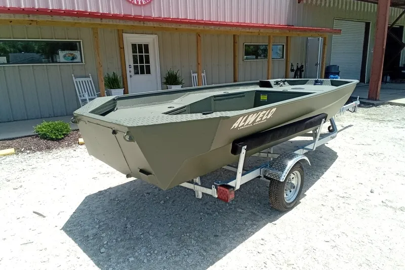 Slide: The Image of 2026 Alweld 1548 Invader boat on trailer outside a building. - 18