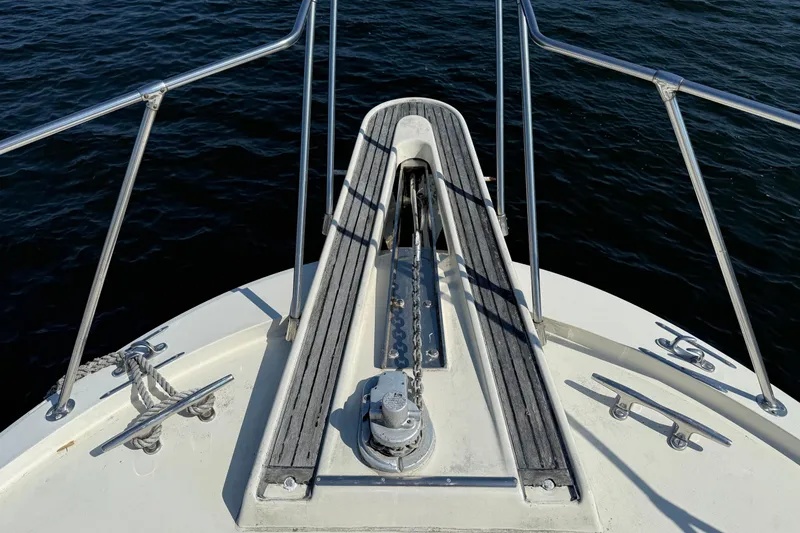 Slide: The Image of Bow of 1979 Hatteras 46 Convertible yacht with anchor chain and cleats. - 8