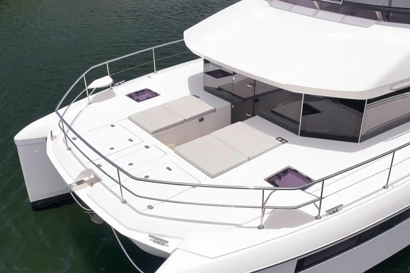 Slide: The Image of 2024 Leopard 46 Powercat yacht with spacious deck and modern design on water. - 16