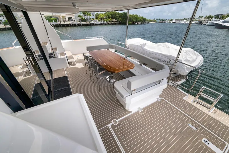 Slide: The Image of Spacious deck of 2024 Leopard 46 Powercat with elegant seating and dining area. - 27