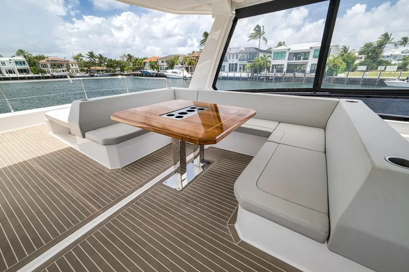 Slide: The Image of Luxurious seating area on 2024 Leopard 46 Powercat yacht with waterfront view. - 28