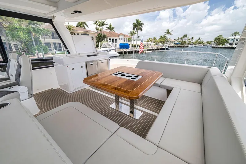 Slide: The Image of Luxurious interior of 2024 Leopard 46 Powercat yacht with elegant seating and wooden table. - 29