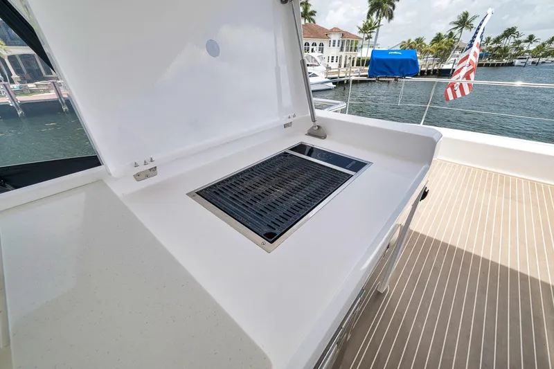 Slide: The Image of Outdoor grill on 2024 Leopard 46 Powercat yacht deck, with waterfront view. - 33
