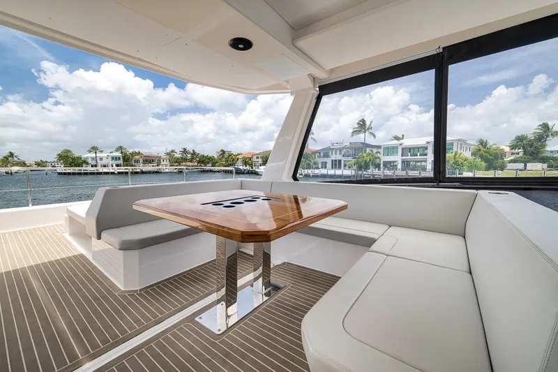 Slide: The Image of Luxurious interior of 2024 Leopard 46 Powercat yacht with elegant seating and waterfront view. - 34